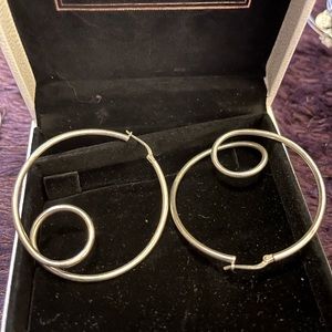Unique rare formed sterling silver round hoop with secure lock latch closure .